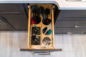 Kitchen Remodel Upgrade Ideas: Cooking utensils organized neatly in pullout cabinet drawer