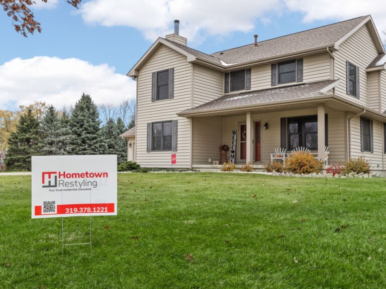 remodeled home with a Hometown Restlying sign in the front yard. Home remodeling warranty
