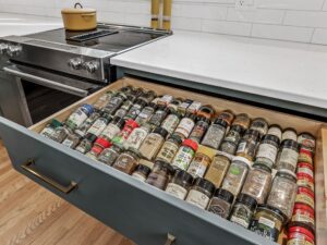 space saving spice rack built into kitchen drawer to keep spices off countertops. hometown restyling