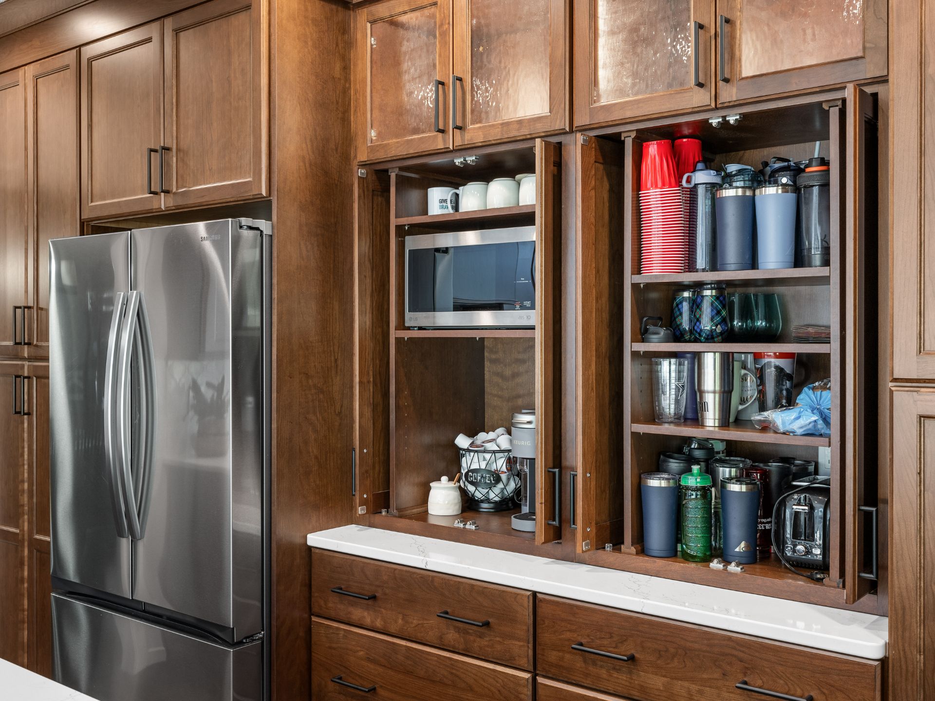 Built in and hidden kitchen design to keep items off countertops but still easily accessible. hometown restyling